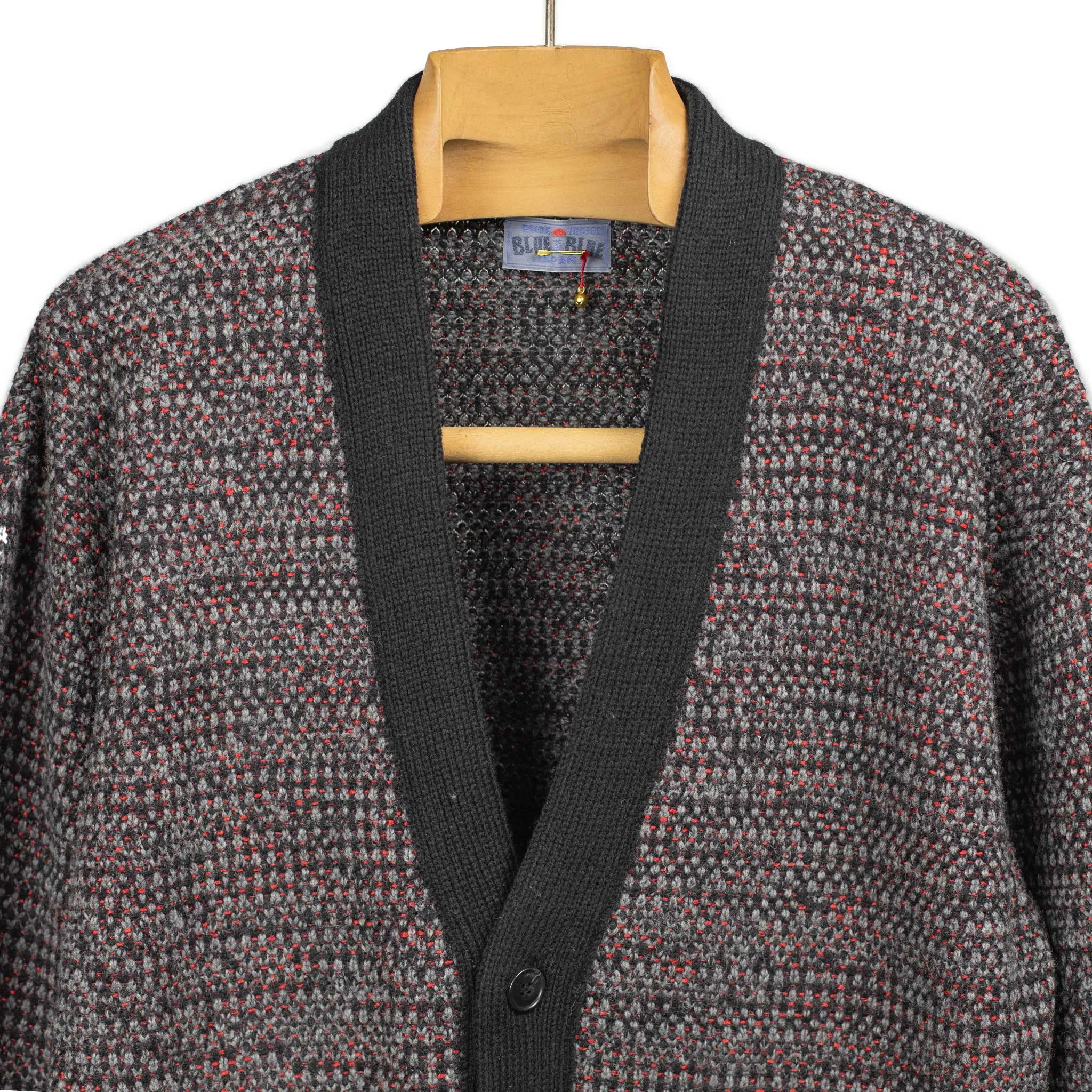 V-neck cardigan in black, grey, and crimson wool mix